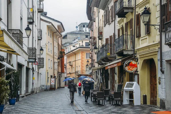 Commercial street during a rainy day in the Italian alpine city of Aosta in northwestern Italy — Stock Photo, Image