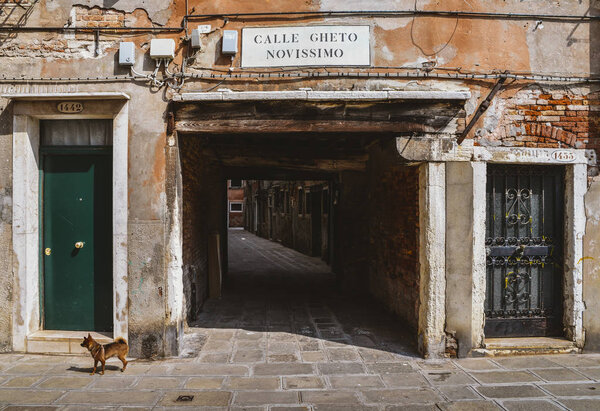 Entrance to an ancient alleyway in the traditional Jewish ghetto of Venice located in the Cannaregio district. Calle Gheto Novissimo in English means New Ghetto Street