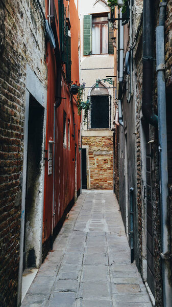 Narrow claustrofobic alley in Venice, Veneto, Italy