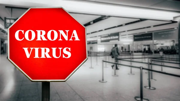 Coronavirus written on stop sign with passengers arriving at passport control within generic airport — Stock Photo, Image