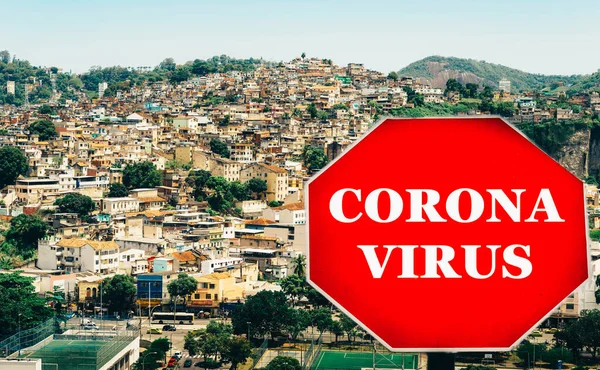 Rio de Janeiro, Brazil hillside shantytown also known as a favela with a Corona virus Covid-19 warning sign.
