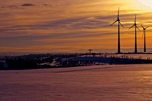 Wind turbines in the sunset on a winter day.