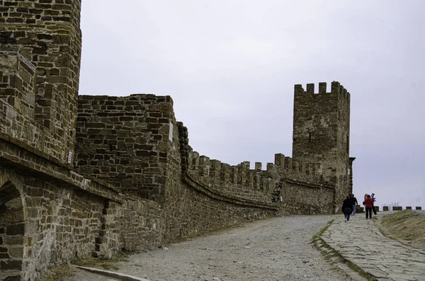 The wall of the old fortress, towers, and structures, the ruins of the old fortress.