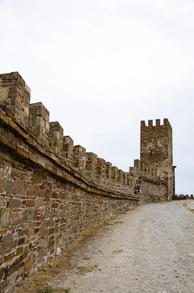 The wall of the old fortress, towers, and structures, the ruins of the old fortress.