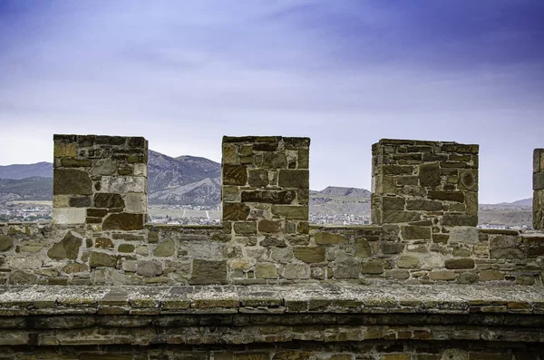 The wall of the old fortress, towers, and structures, the ruins of the old fortress.