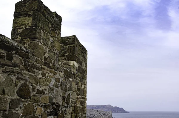 The wall of the old fortress, towers, and structures, the ruins of the old fortress.