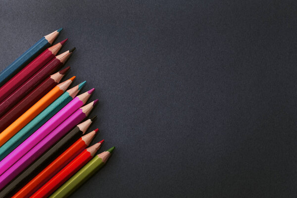 Coloured pencils isolated on the black background