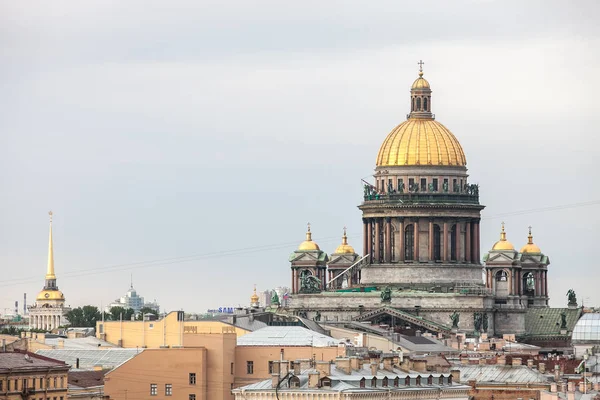 Beautiful cityscape. Rainy day at Saint-Petersburg, Russia. Rooftop view on old buildings and St Isaac Cathedral.