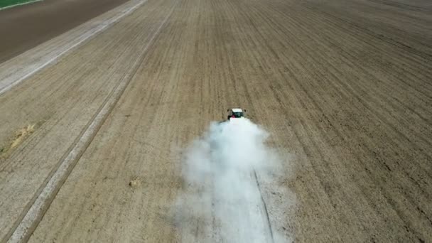 Top View Tractor Sprays Fertilizer Agricultural Field Aerial Shot Windy — Stock Video
