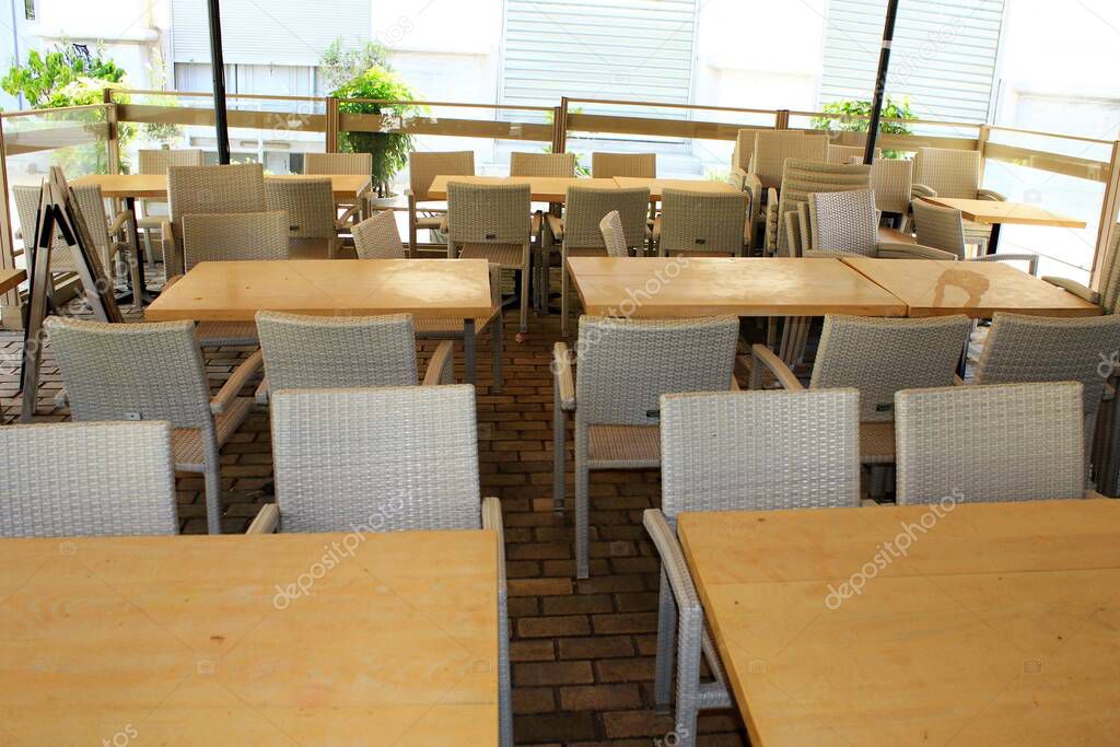 Athens, Greece, April 7 2020 - Empty cafe-restaurant during the Coronavirus lockdown.