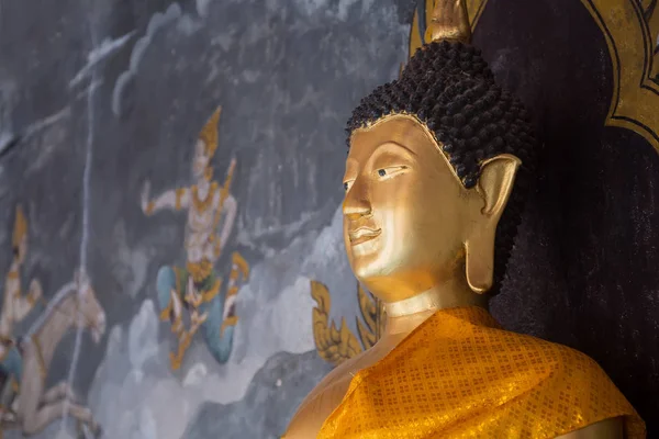 Details of golden buddha statue with tales of the lord Buddha's — Stock Photo, Image