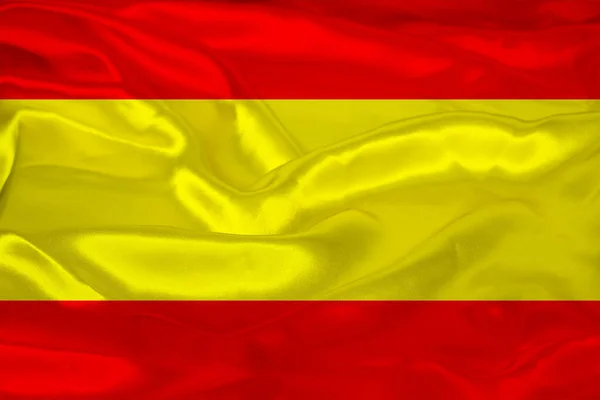 Krásná fotografie barevné národní vlajky moderního španělského státu na texturované látce, koncept cestovního ruchu, emigrace, ekonomie a politika, detailní záběr — Stock fotografie