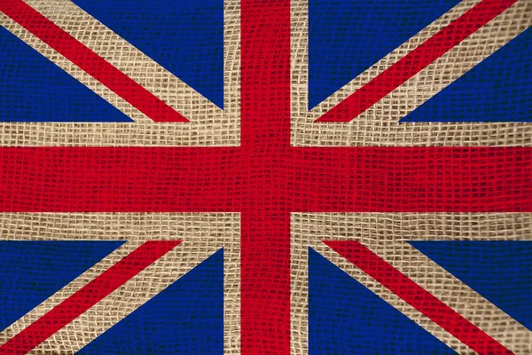 Foto della bella bandiera nazionale colorata dello stato moderno della Gran Bretagna su tessuto strutturato, concetto di turismo, emigrazione, economia e politica, primo piano — Foto Stock
