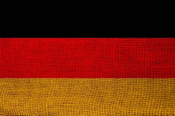 Modern Almanya devletinin dokulu kumaş, turizm, göç, ekonomi ve siyaset konsepti üzerindeki güzel renkli ulusal bayrağının fotoğrafı, yakın plan — Stok fotoğraf