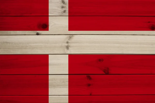 Foto van de nationale vlag van Denemarken op een luxueuze textuur van satijn, zijde met golven, plooien en hoogtepunten, close-up, kopieerruimte, reisconcept, economie en staatsbeleid — Stockfoto