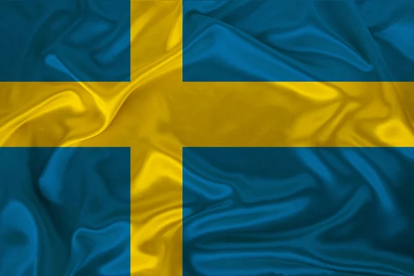 Foto av statens flagga av staten Sverige på en lyxig konsistens av satin, silke med vågor, veck och höjdpunkter, närbild, kopiera utrymme, illustration — Stockfoto