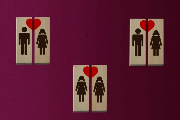 union symbol of 2 men and 2 women on wooden blocks, with a red heart, and two women, the concept of same-sex and heterosexual love, copy space
