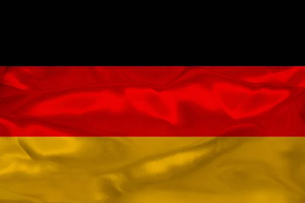 Beautiful photo of the colored national flag of the modern state of Germany on textured fabric, concept of tourism, emigration, economics and politics, closeup — Stockfoto