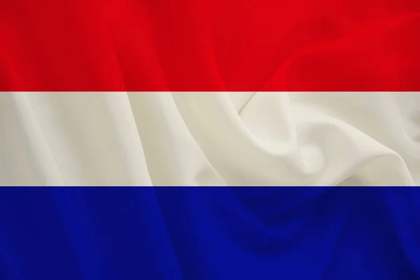 Nationale vlag van Nederland op zachte zijde met windvouwen, reisconcept, immigratie, politiek, kopieerruimte, close-up — Stockfoto