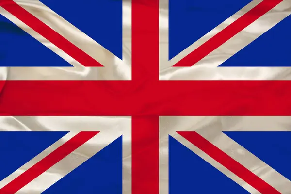 Vacker bild av en färgad nationell flagga av den moderna staten Storbritannien på en strukturerad tyg, begreppet turism, emigration, ekonomi och politik, närbild — Stockfoto