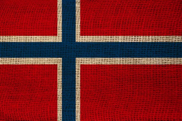 Beautiful photo of the colored national flag of the modern state of Norway on textured fabric, concept of tourism, emigration, economics and politics, close up — Stock Photo, Image