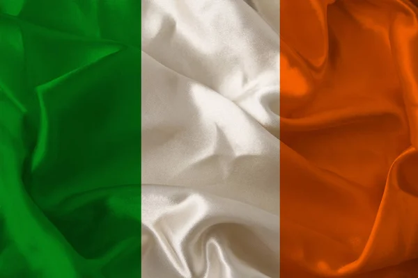 Όμορφη φωτογραφία της έγχρωμης εθνικής σημαίας του σύγχρονου κράτους της Ιρλανδίας σε υφή υφάσματος, έννοια του τουρισμού, της μετανάστευσης, της οικονομίας και της πολιτικής, closeup — Φωτογραφία Αρχείου