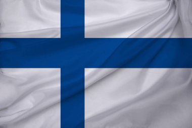 Finlandiya devletinin dokuma, turizm, ekonomi ve siyaset konsepti üzerine güzel renkli ulusal bayrağı, yakın plan