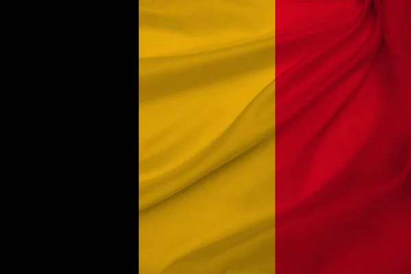 Photograph of the beautiful colored national flag of the modern state of Belgium on textured fabric, concept of tourism, economics and politics, close-up — Stock Photo, Image
