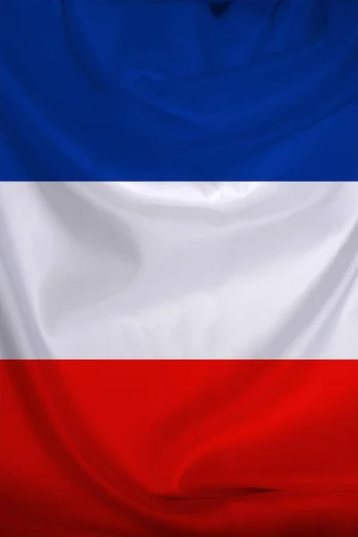 Photo du beau drapeau national coloré de l'état moderne de la France sur tissu texturé, concept de tourisme, émigration, économie et politique, gros plan — Photo