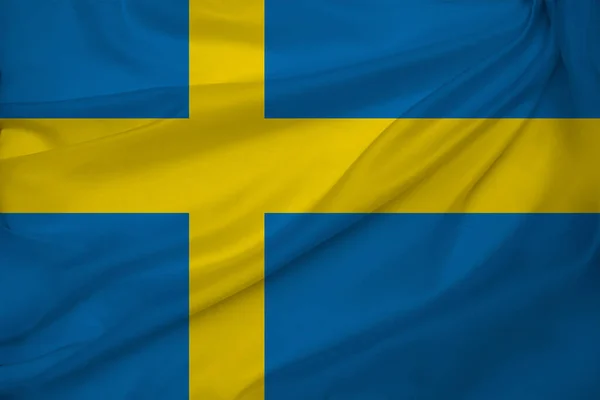Foto della bella bandiera nazionale colorata dello stato moderno della Svezia su un tessuto strutturato, concetto di turismo, emigrazione, economia e politica, primo piano — Foto Stock