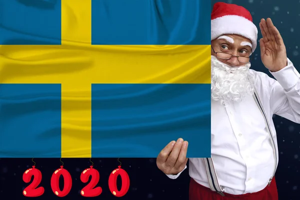 Φωτογραφία της όμορφης έγχρωμης εθνικής σημαίας του σύγχρονου κράτους της Σουηδίας σε ένα υφασμένο ύφασμα, έννοια του τουρισμού, της μετανάστευσης, της οικονομίας και της πολιτικής, closeup — Φωτογραφία Αρχείου