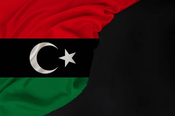 Національний прапор сучасної Лівії, красивий шовк, чорна порожня форма, концепція туризму, економіки, політики, еміграції, день незалежності, копіювання простору, шаблон, горизонталі — стокове фото