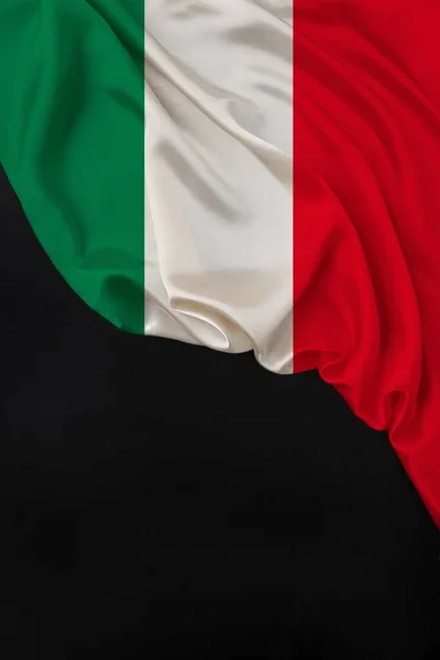 vertical color national flag of modern state of Italy, beautiful silk, black blank, concept of tourism, economy, politics, emigration, independence day, copy space, template