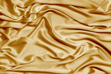 altın güzel satoin kumaş yumuşak kıvrımlar, ipek bez arka plan, yakın çekim, kopyalama alanı ile dökümlü