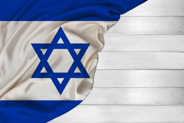 Horizontal color national flag of modern state of Israel, beautiful silk, white wood background, concept of tourism, economy, politics, emigration, independence day, copy space, template — Stock Photo, Image