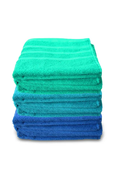 Pile of clean terry bath colored towels isolated on a white background, close-up, copy space, concept of cleanliness, bath procedure, spa — Stockfoto