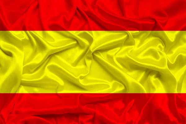 Bela foto da bandeira nacional da Espanha em seda brilhante delicada com cortinas macias, o conceito da vida nacional do país, horizontal, close-up, espaço de cópia — Fotografia de Stock