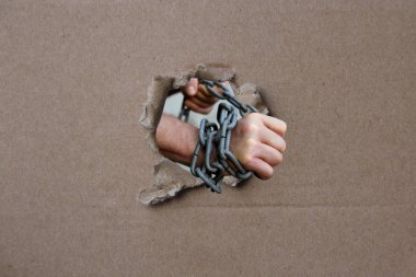 male hands wrapped in a thick heavy iron chain, a symbol of the arrest of a criminal clipart
