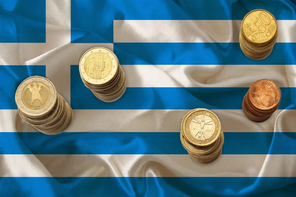 Piles of coins of the European Union currency against the background of the flag of the country of Greece, financial concept, dynamics of the national currency, devaluation of finance, inflation — 스톡 사진