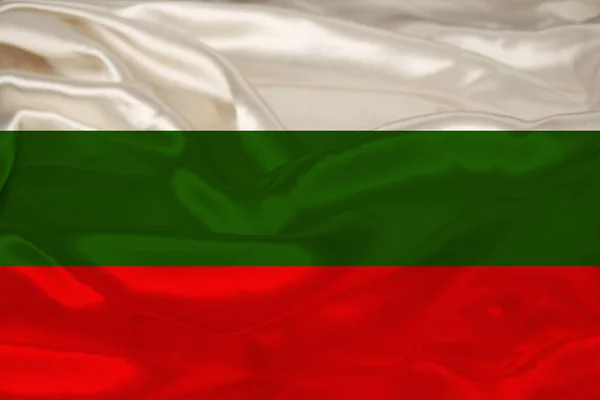 Hermosa foto de la bandera nacional de color del estado moderno de Bulgaria en tela texturizada, concepto de turismo, emigración, economía y política, primer plano —  Fotos de Stock
