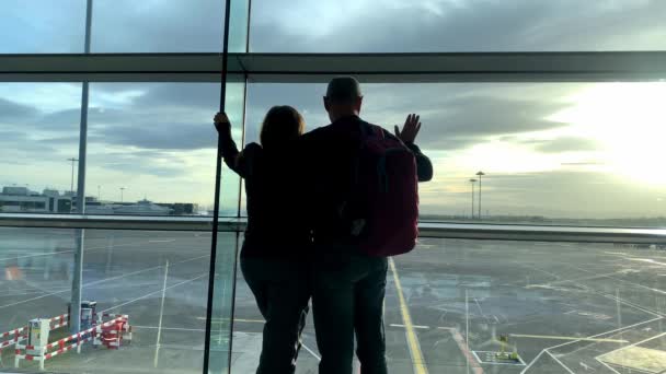 Two Tourists Man Woman Backpack Standing Airport Lounge Looking Out — 비디오