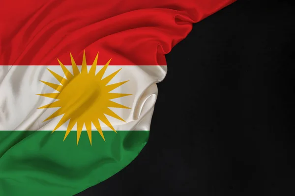 color national flag of modern state of Kurdistan, beautiful silk, black blank form, concept of tourism, economy, politics, emigration, independence day, copy space, template, horizontal