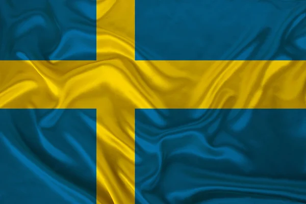 Photo of the national flag of the state of Sweden on a luxurious texture of satin, silk with waves, folds and highlights, close-up, copy space, illustration — Stock Photo, Image