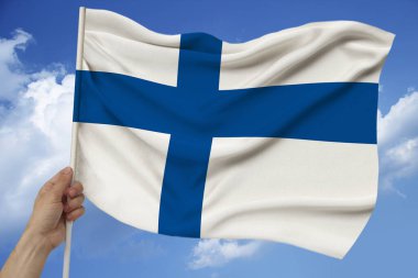 Finlandiya devletinin dokuma, turizm, ekonomi ve siyaset konsepti üzerine güzel renkli ulusal bayrağı, yakın plan