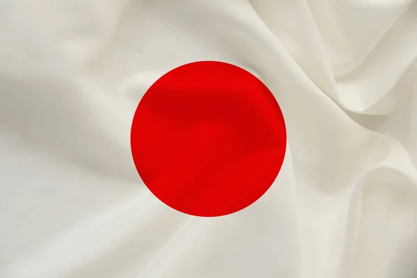 Nationale vlag van het land Japan op zachte zijde met wind plooien, reizen concept, immigratie, politiek, kopie ruimte, close-up — Stockfoto