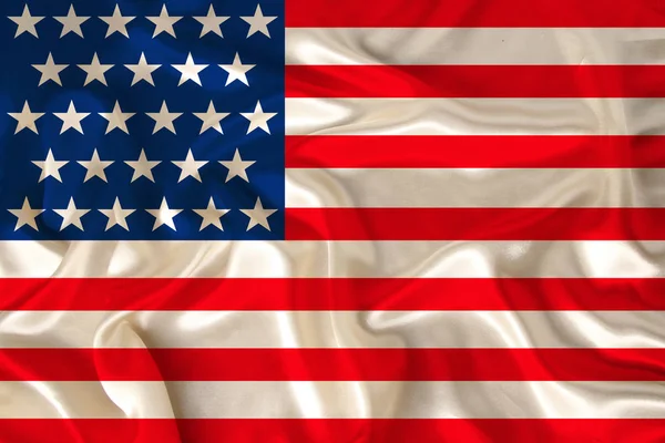 national flag of the USA country on luxurious texture of satin, silk with waves, travel concept, immigration, politics