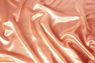 hassas pembe yumuşak kıvrımlar, turuncu parlak ipek, lüks konsept, tasarımcı için arka plan, yatay, yakın çekim, kopyalama alanı
