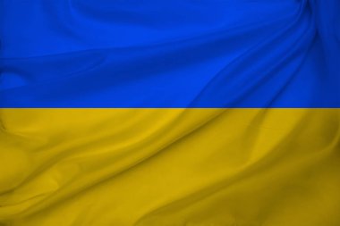 Modern Ukrayna devletinin turizm, göç, ekonomi ve siyaset konsepti üzerindeki güzel renkli ulusal bayrağının fotoğrafı