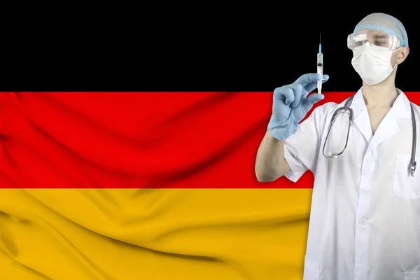 Doctor Stethoscope Backdrop Silk National Flag Germany Holds Medical Syringe — Stock Photo, Image