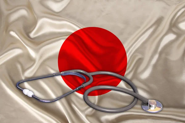 doctors tool, medical stethoscope, lies on the silk national flag of the state of China, concept of tourism, insurance, health, pediatrics